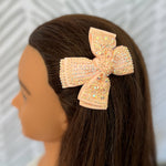 Bejeweled peach hair bow